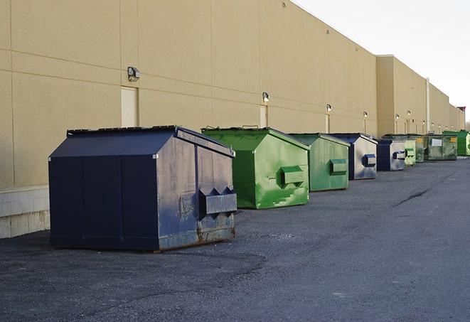 heavy-duty roll-off dumpsters outside a construction zone in Bloomfield